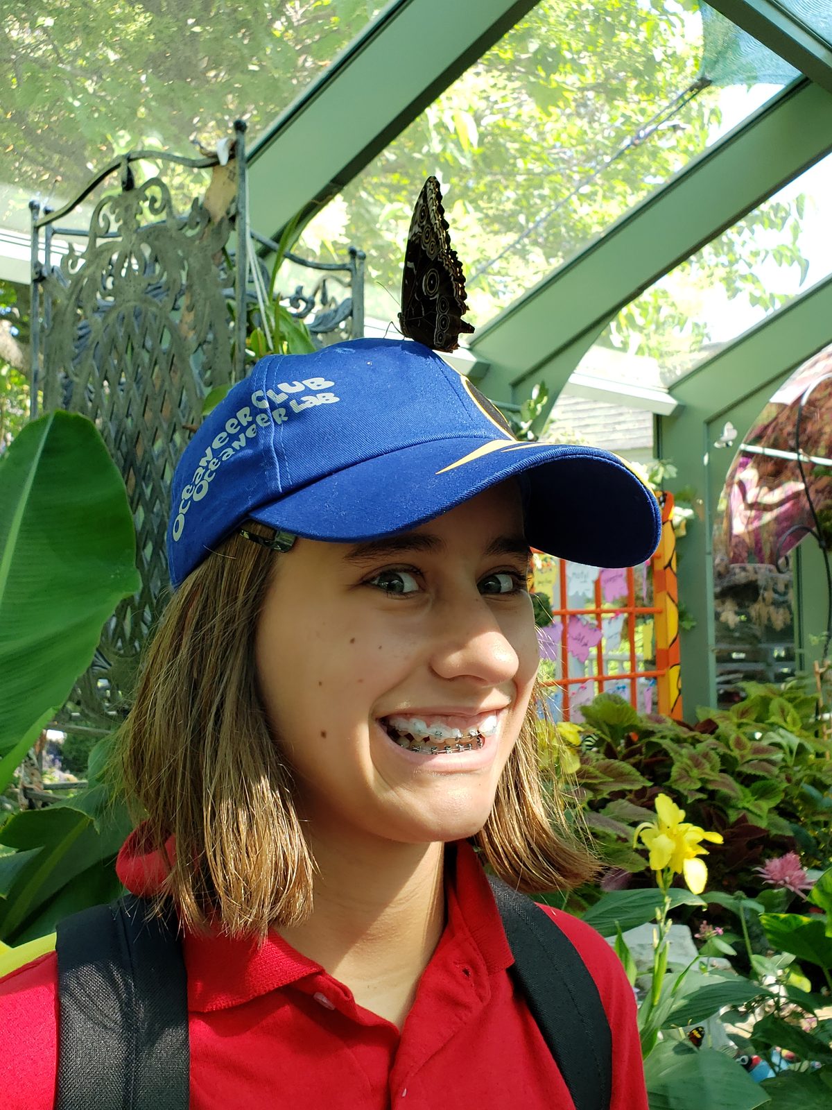 Lisa with a butterfly on her cap