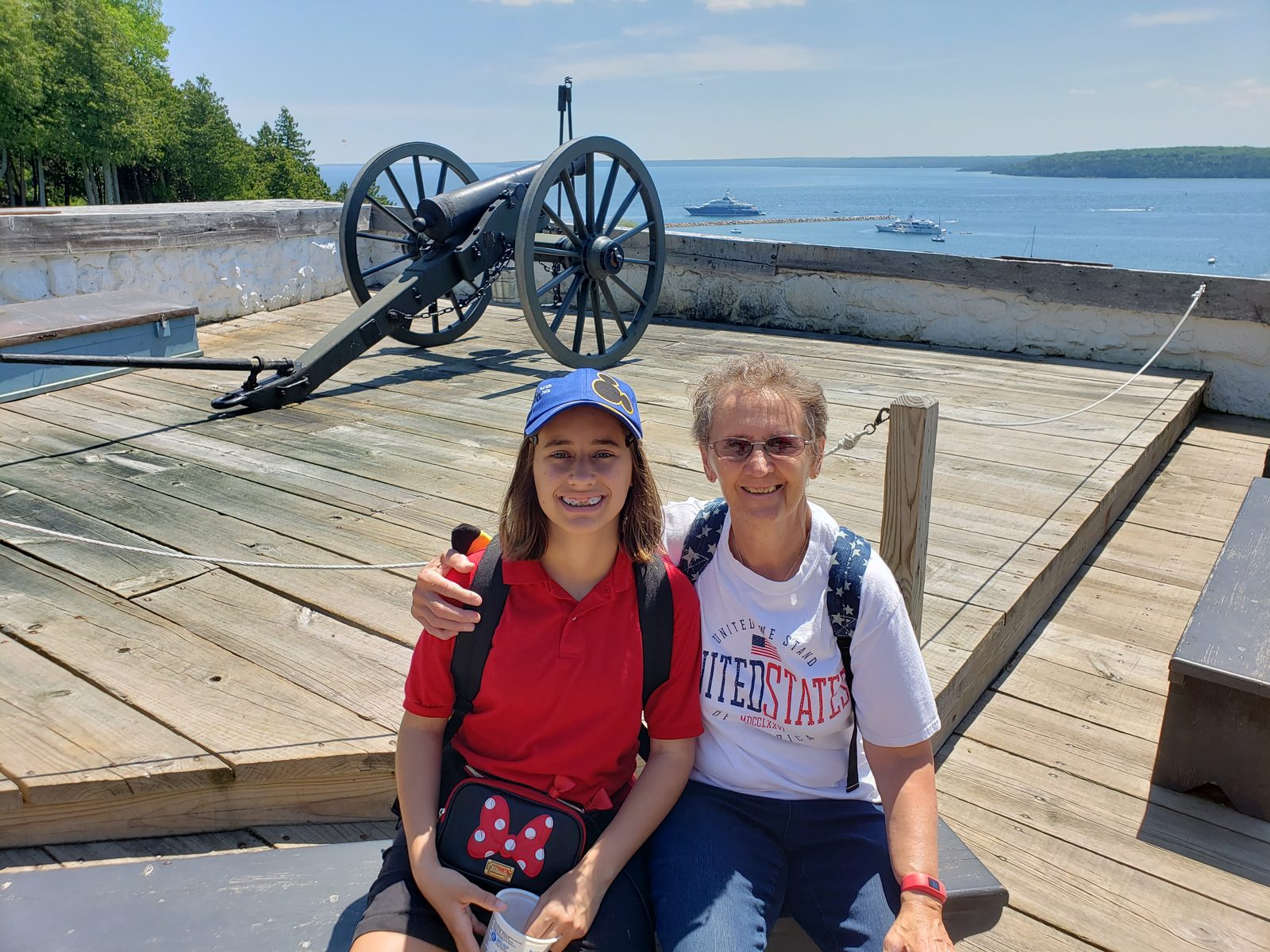 Lisa and Grandma by a fort cannon