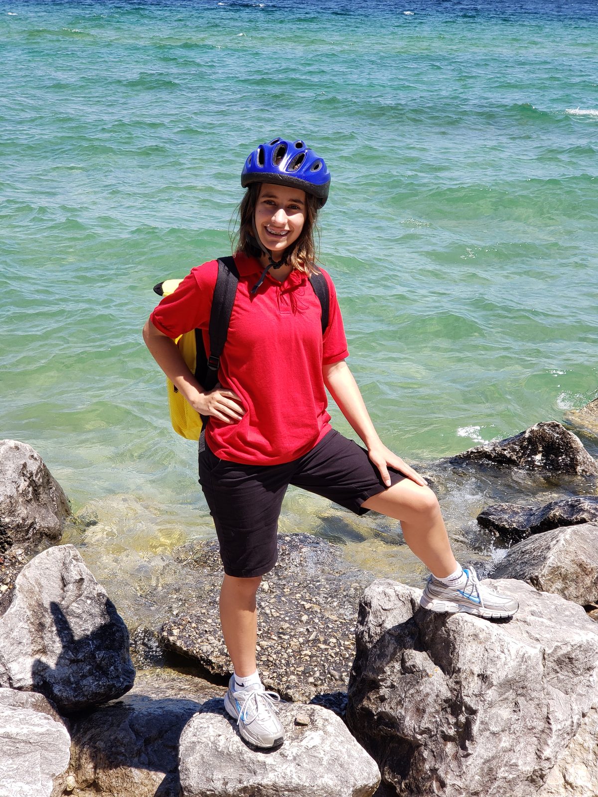 Lisa on the rocky shore on Mackinac Island