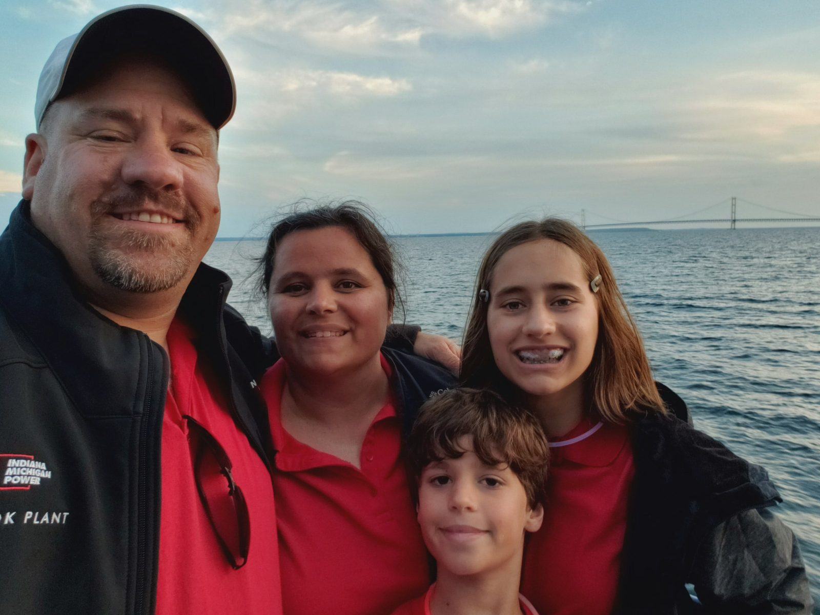 Kathy, the kids and me on the ferry with the bridge behind