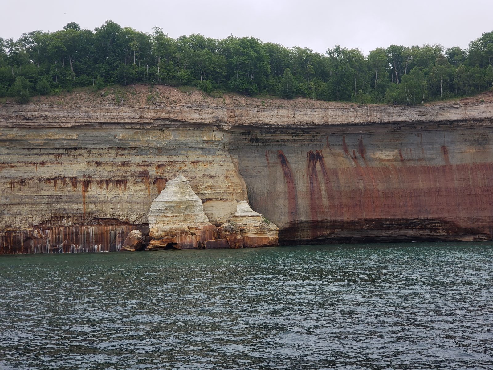 Mineral streaks on the cliffs from the boat