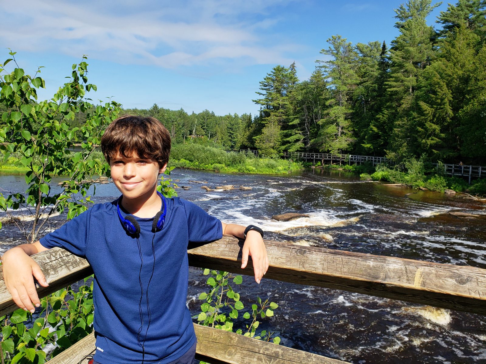 Thomas at the railing above the rapids