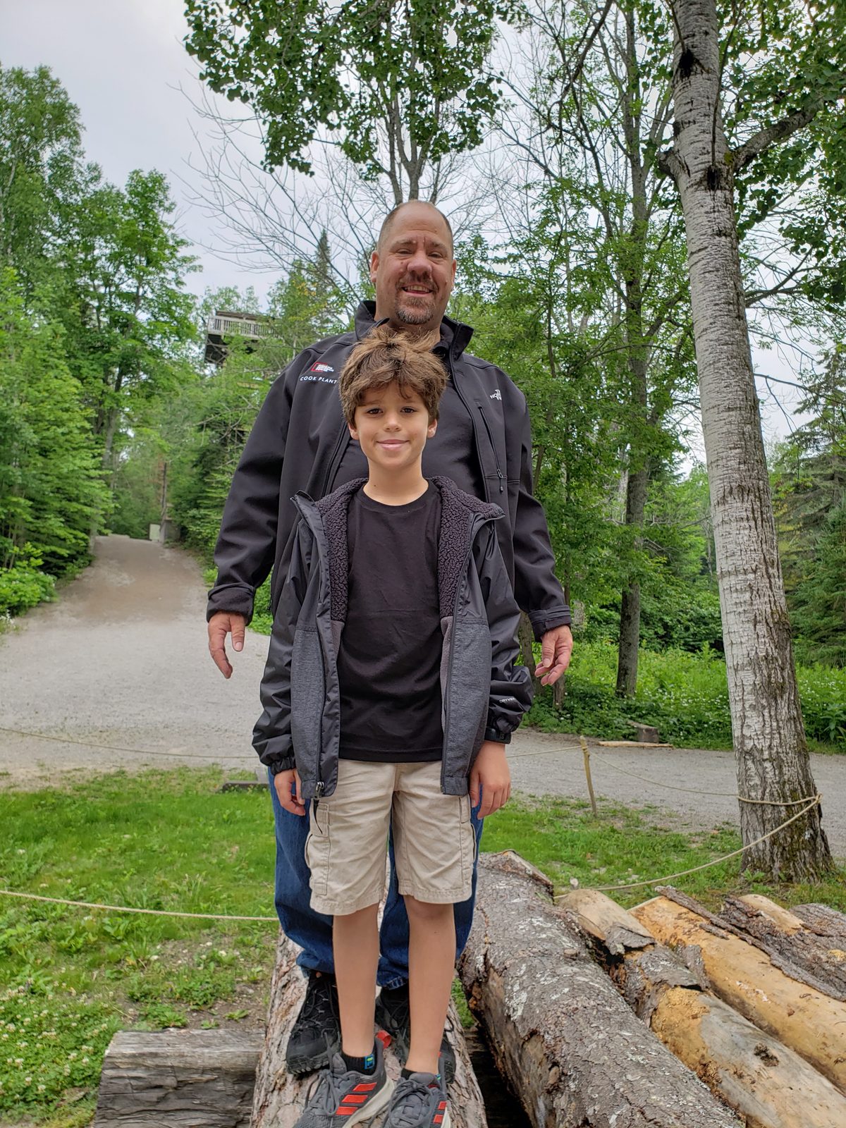 Thomas and Michael by the log pile at Mill Creek