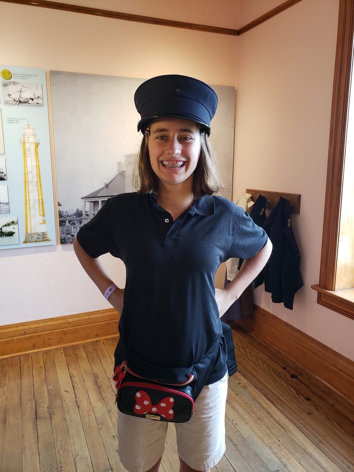 Lisa trying on a hat at Old Mackinac Point Lighthouse