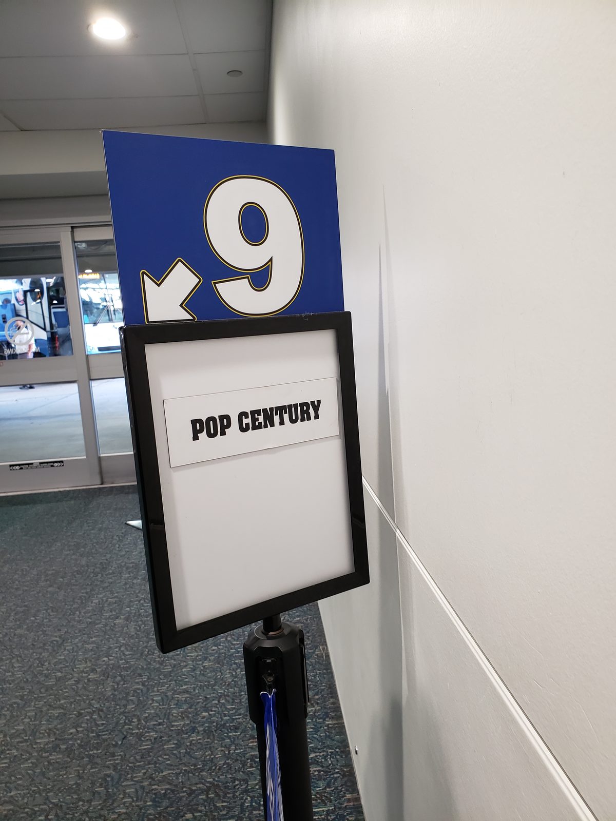 The sign for Pop Century at Disney's Magical Express