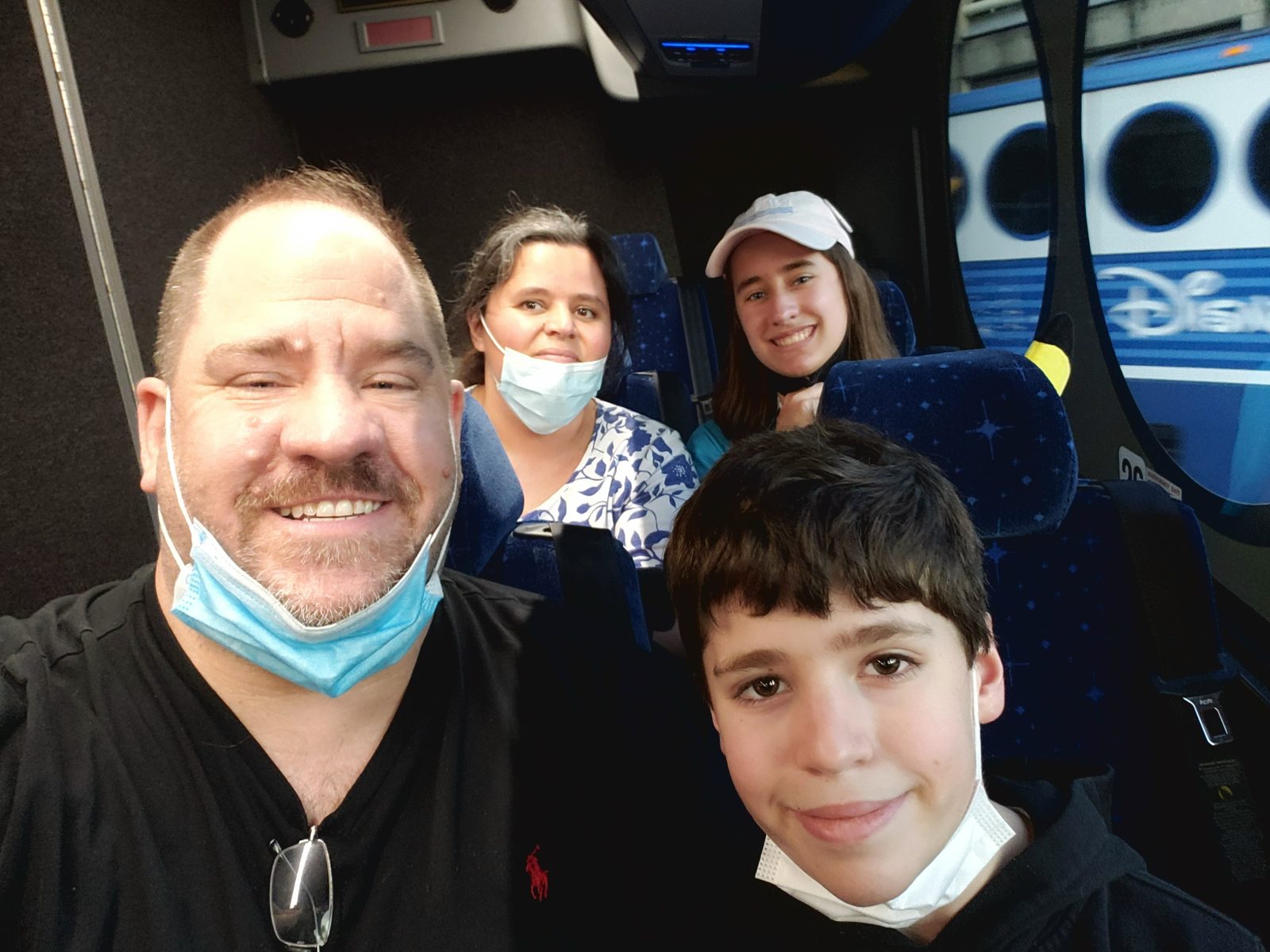 Masked up with the whole family on the Disney bus