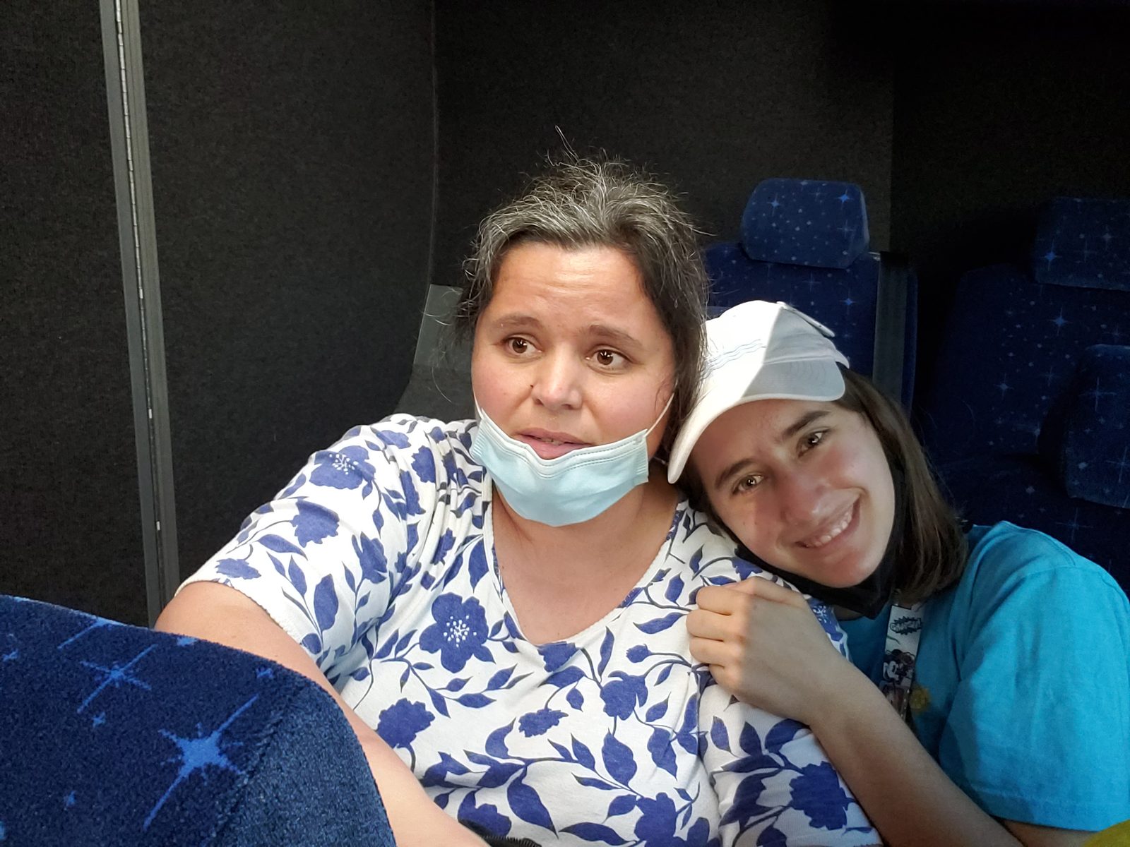 Kathy and Lisa cuddled up on the bus ride in
