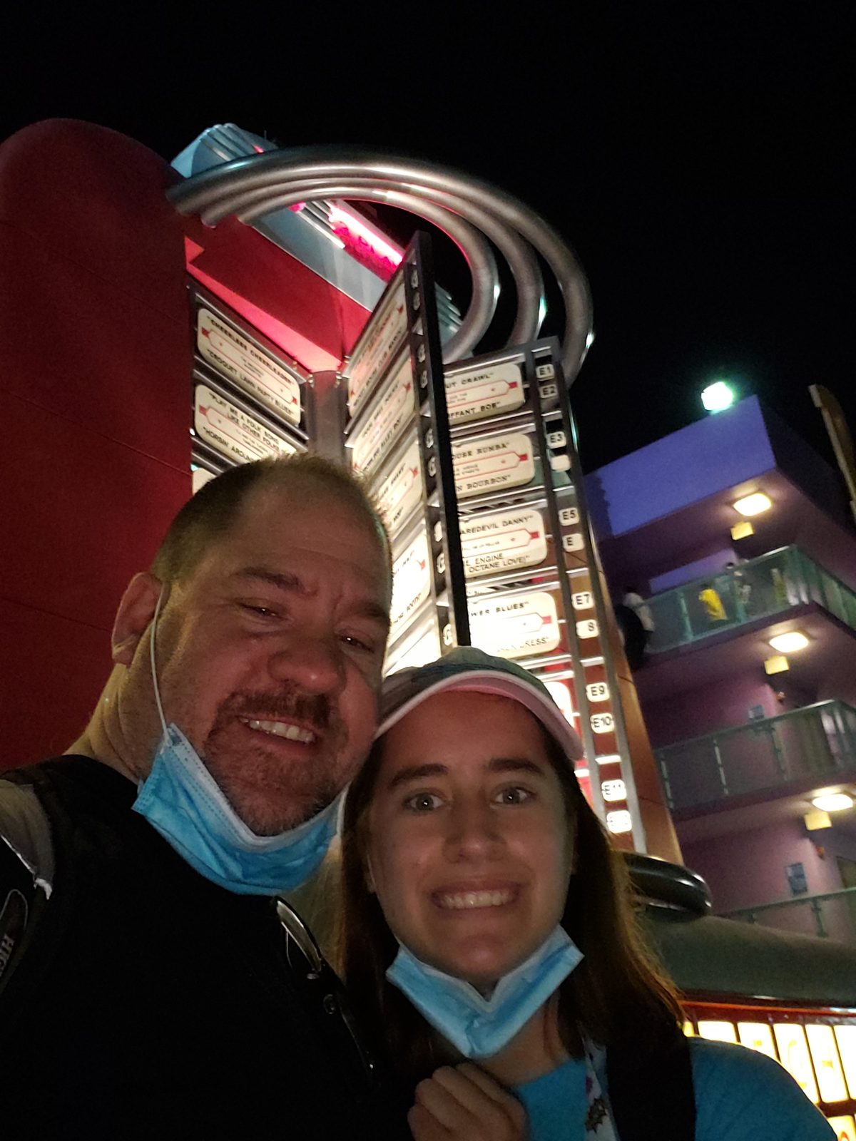 Lisa and me under the giant resort decorations at night