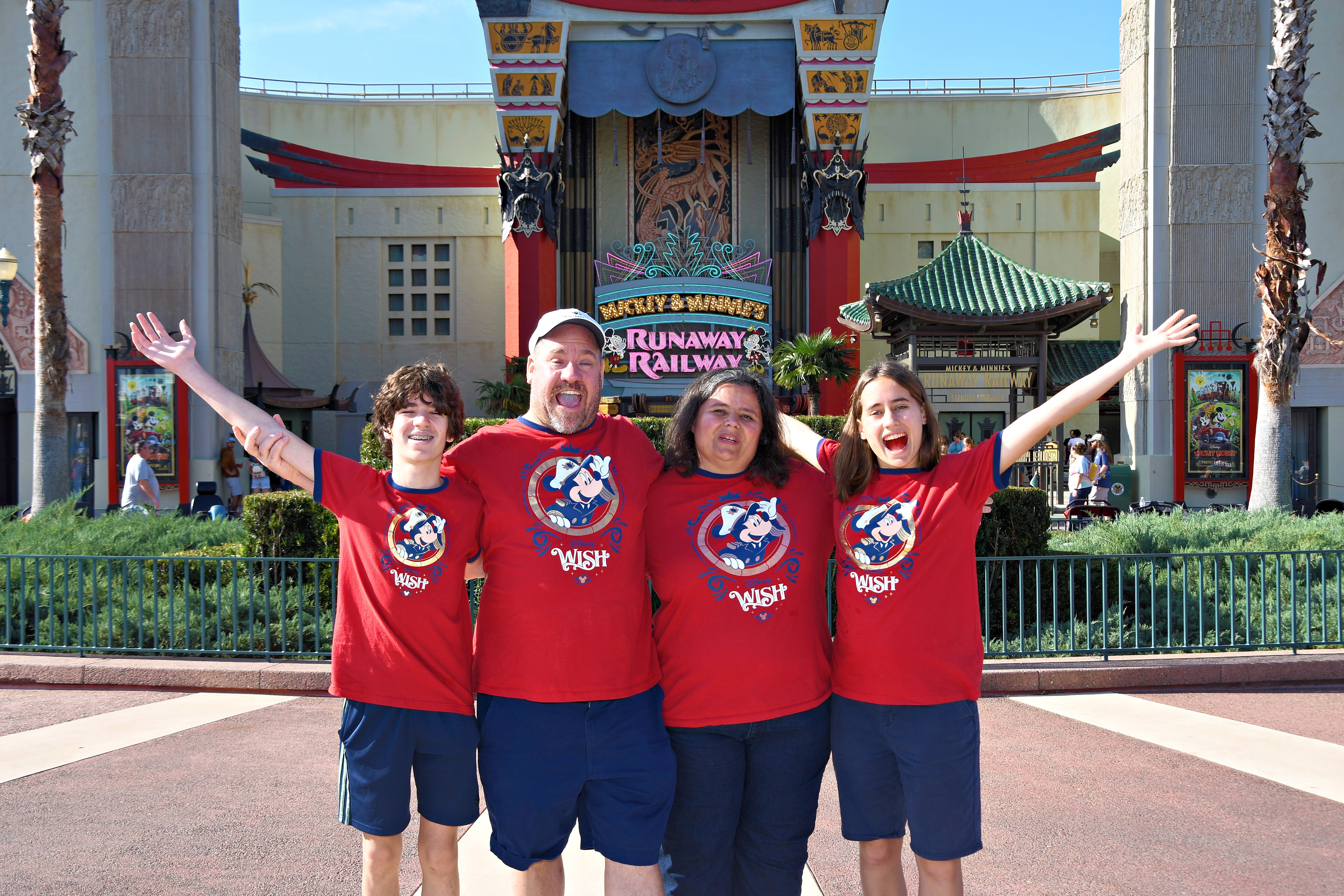 All four of us outside Mickey and Minnie's Runaway Railway