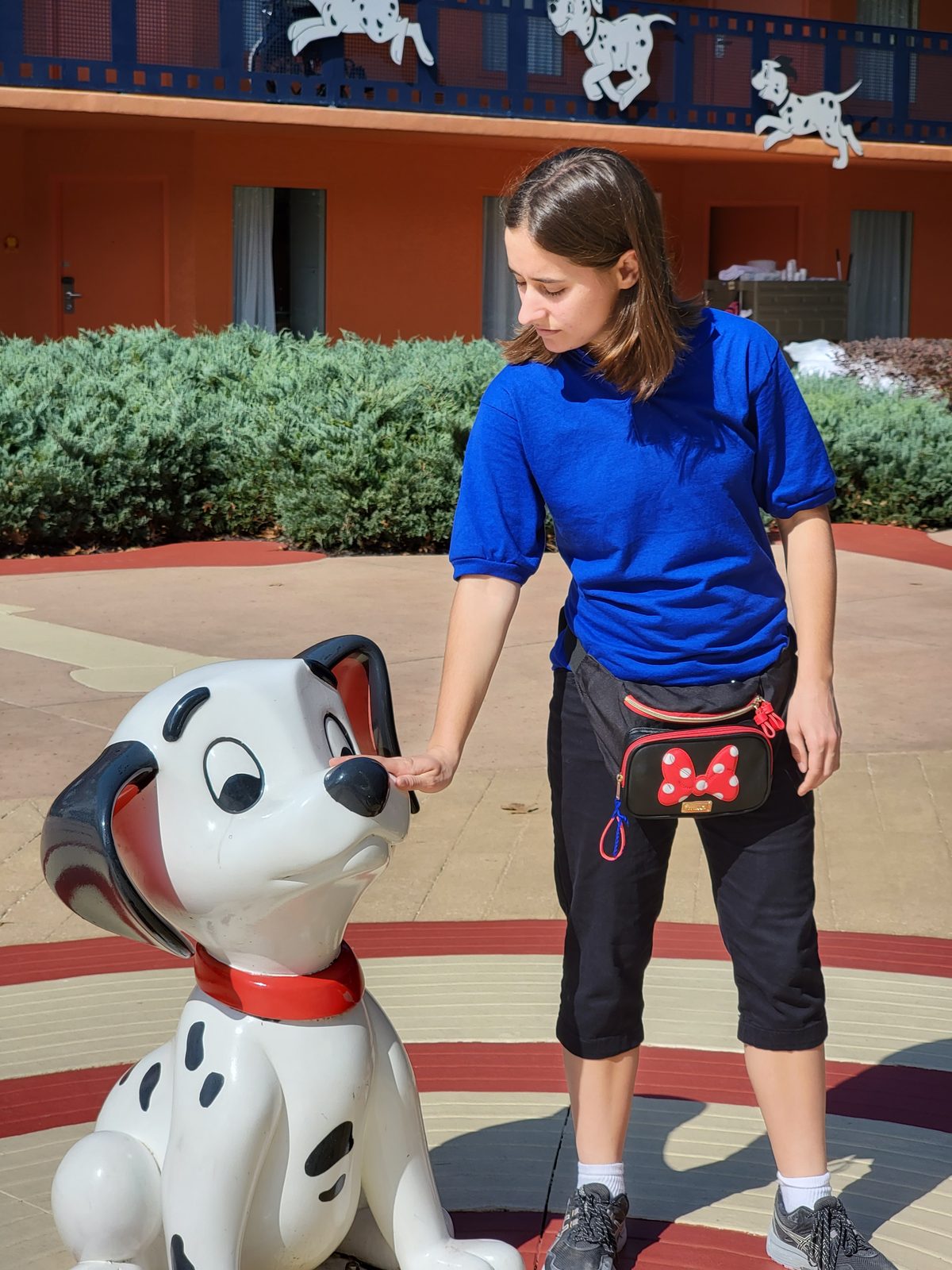 Lisa petting a Dalmatian pup at All-Star Movies