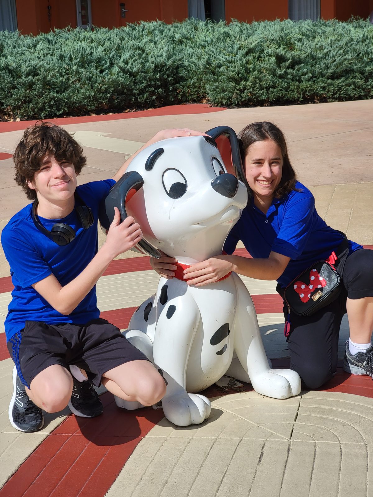 Thomas and Lisa hugging a Dalmatian pup at All-Star Movies
