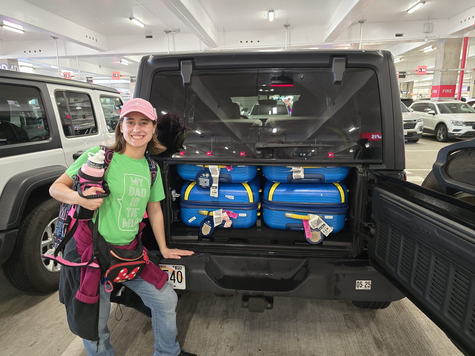 Lisa poses with our loaded rental Jeep