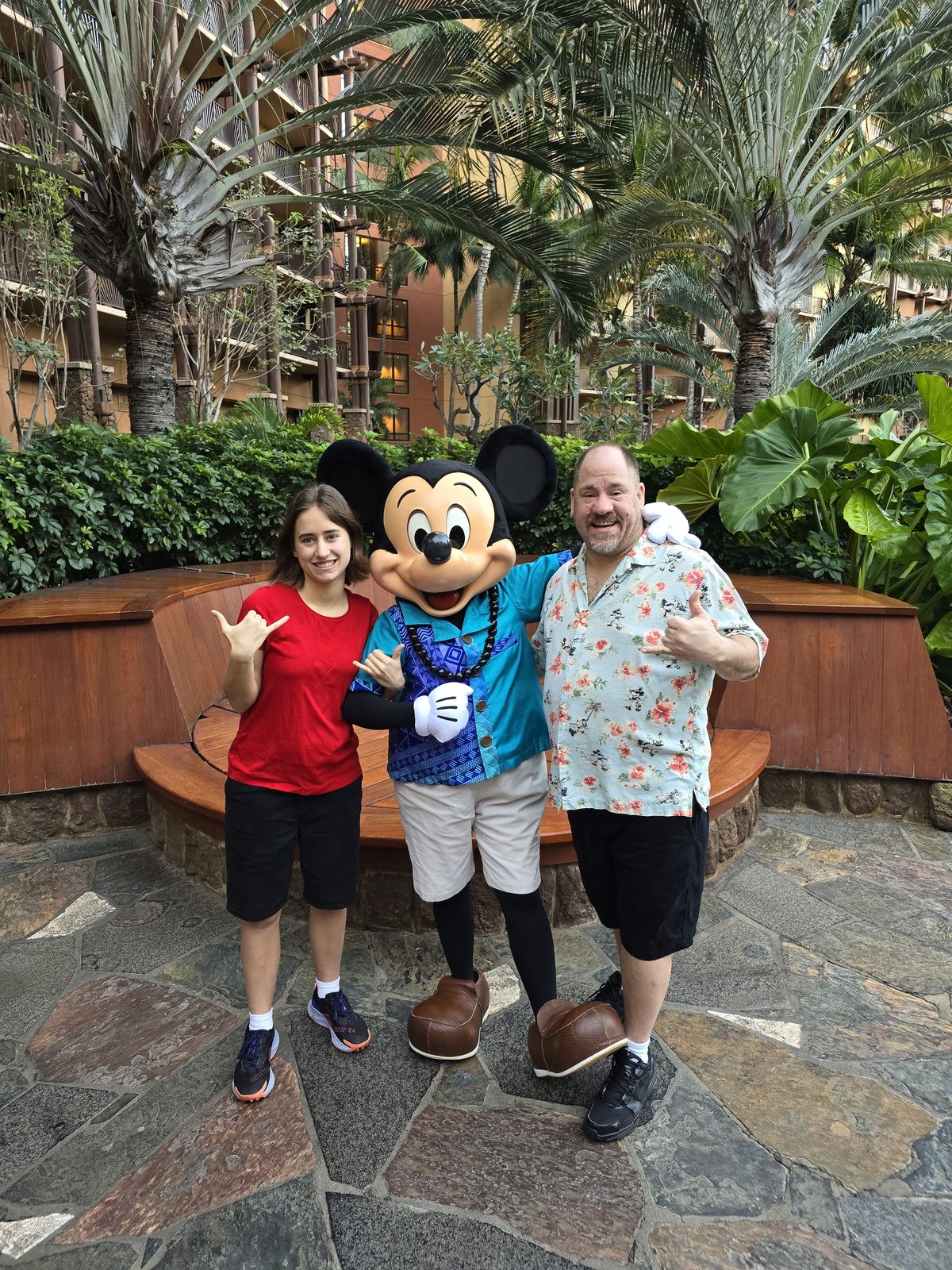 Lisa, Mickey Mouse in his aloha outfit and Michael at Aulani