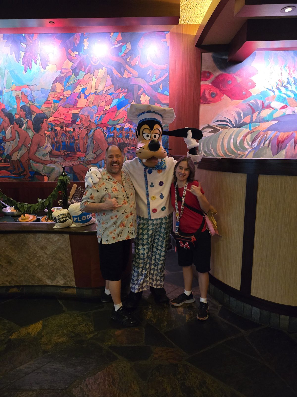Michael, Goofy in his chef's outfit and Lisa at Aulani