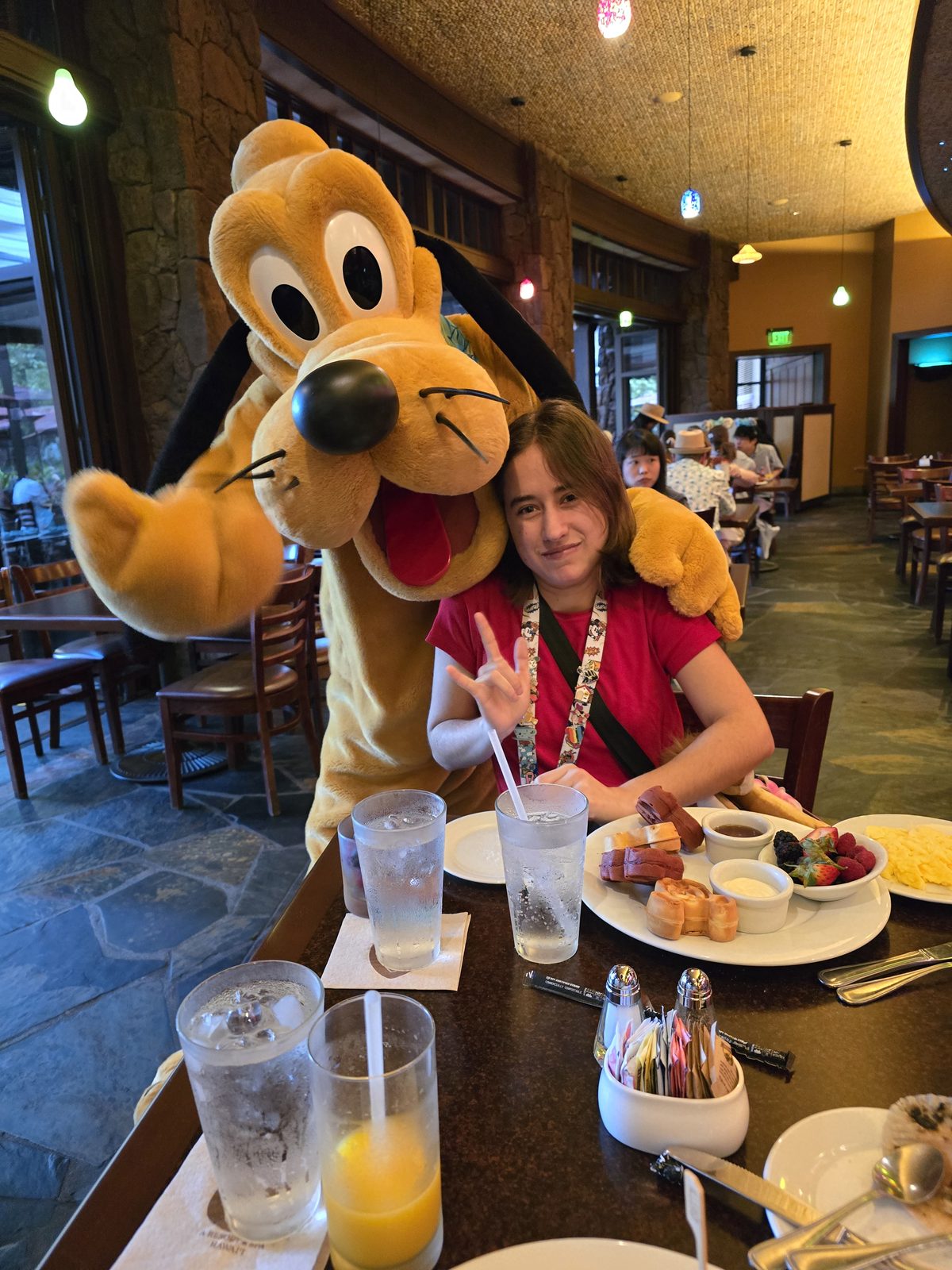 Pluto stopping by our breakfast table with Lisa