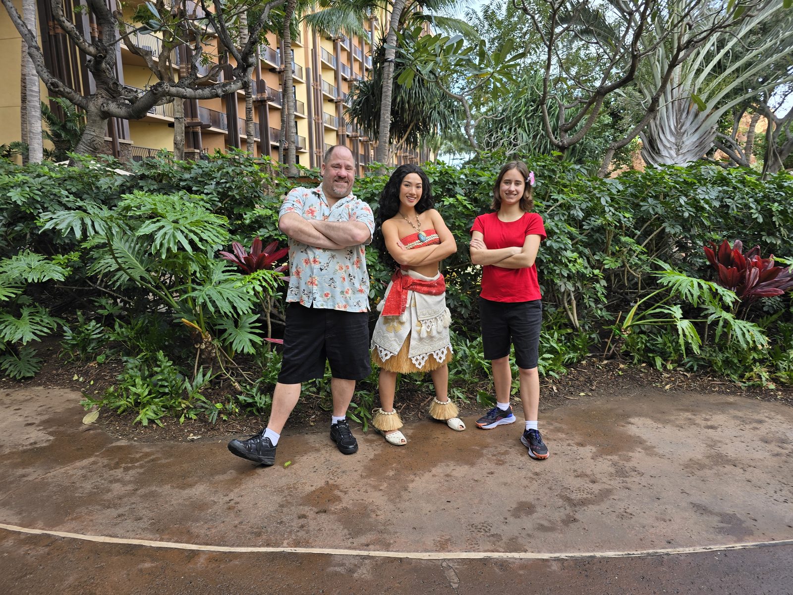 Moana between Michael and Lisa on the resort grounds