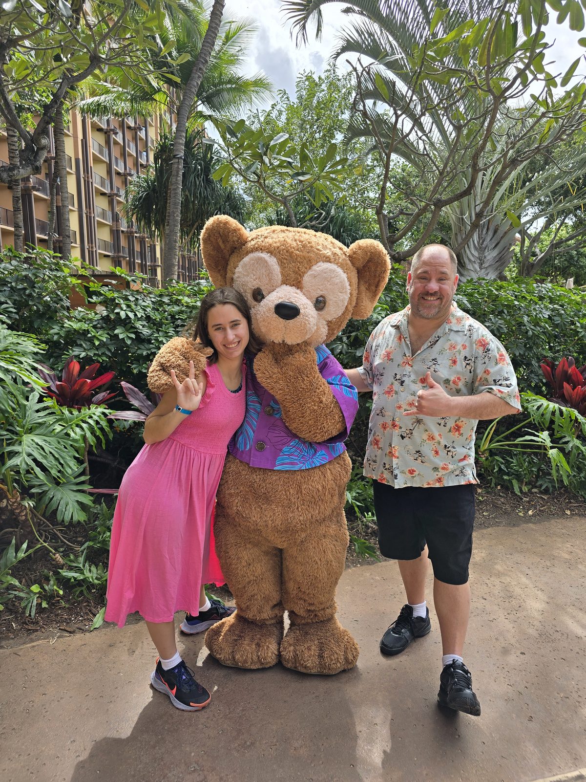 Lisa, Duffy in his aloha shirt and Michael at Aulani