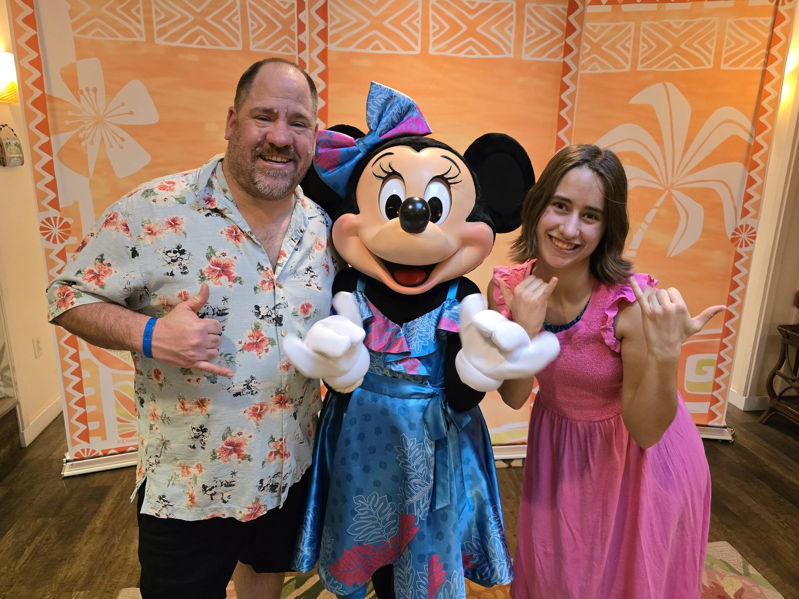 Michael, Minnie Mouse in her blue evening dress and Lisa at Aulani