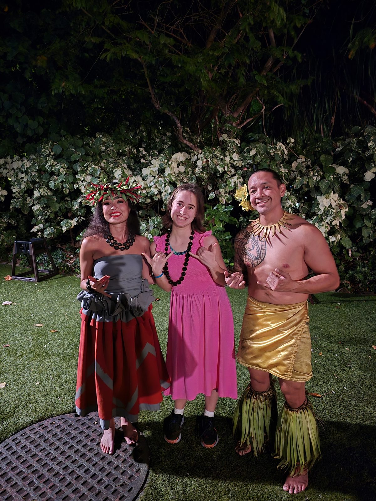 Lisa poses with our luau hosts