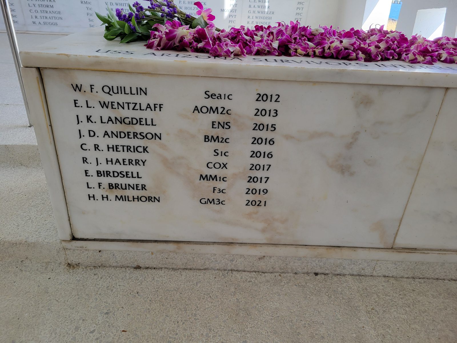 Flowers laid above the survivors' names