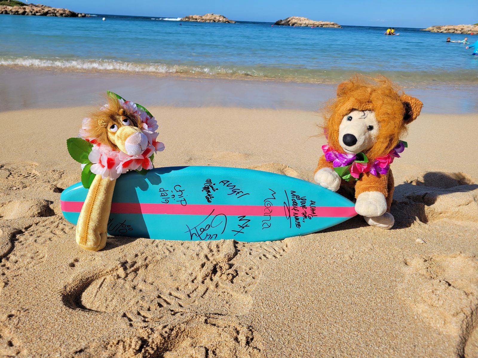 Bob and Leo with the signed surfboard