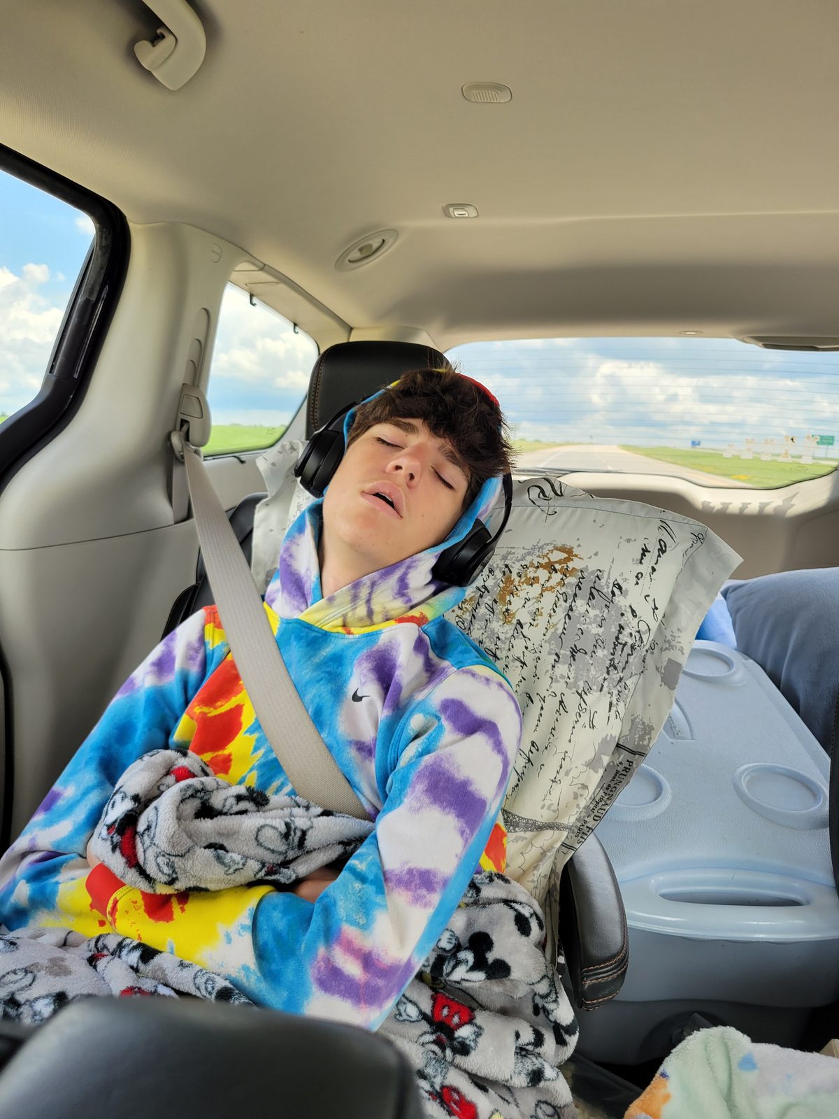 Thomas asleep in the back seat