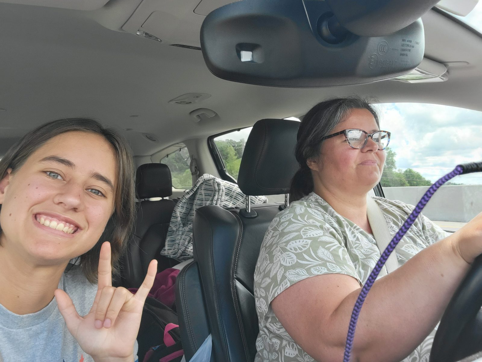 Kathy driving, Lisa signs I love you
