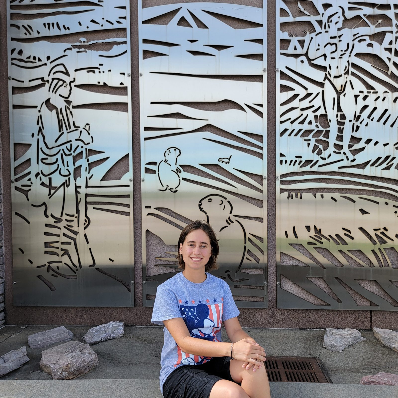Lisa by the cut-out prairie scenes at Dignity