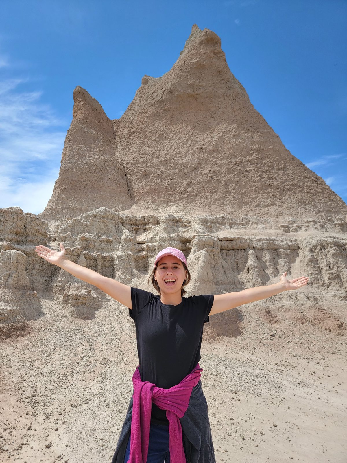 Lisa in front of a spire in the Badlands