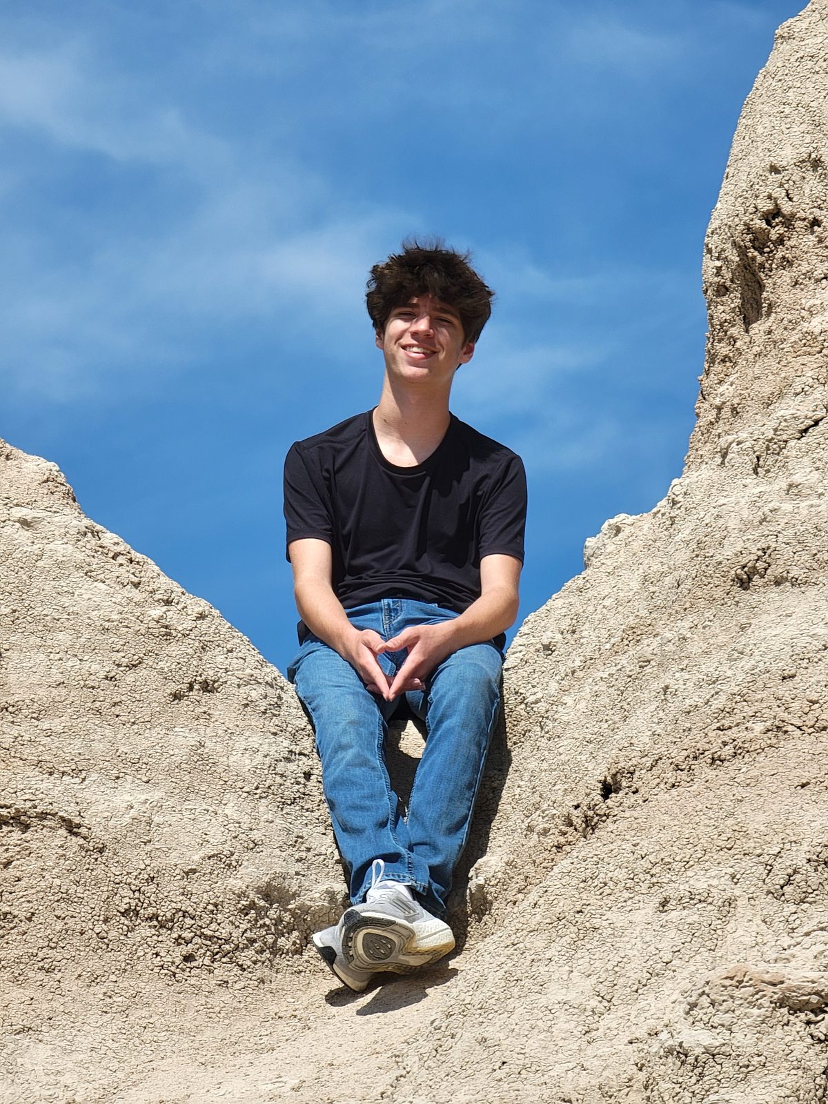 Thomas tucked into a notch in the Badlands rocks