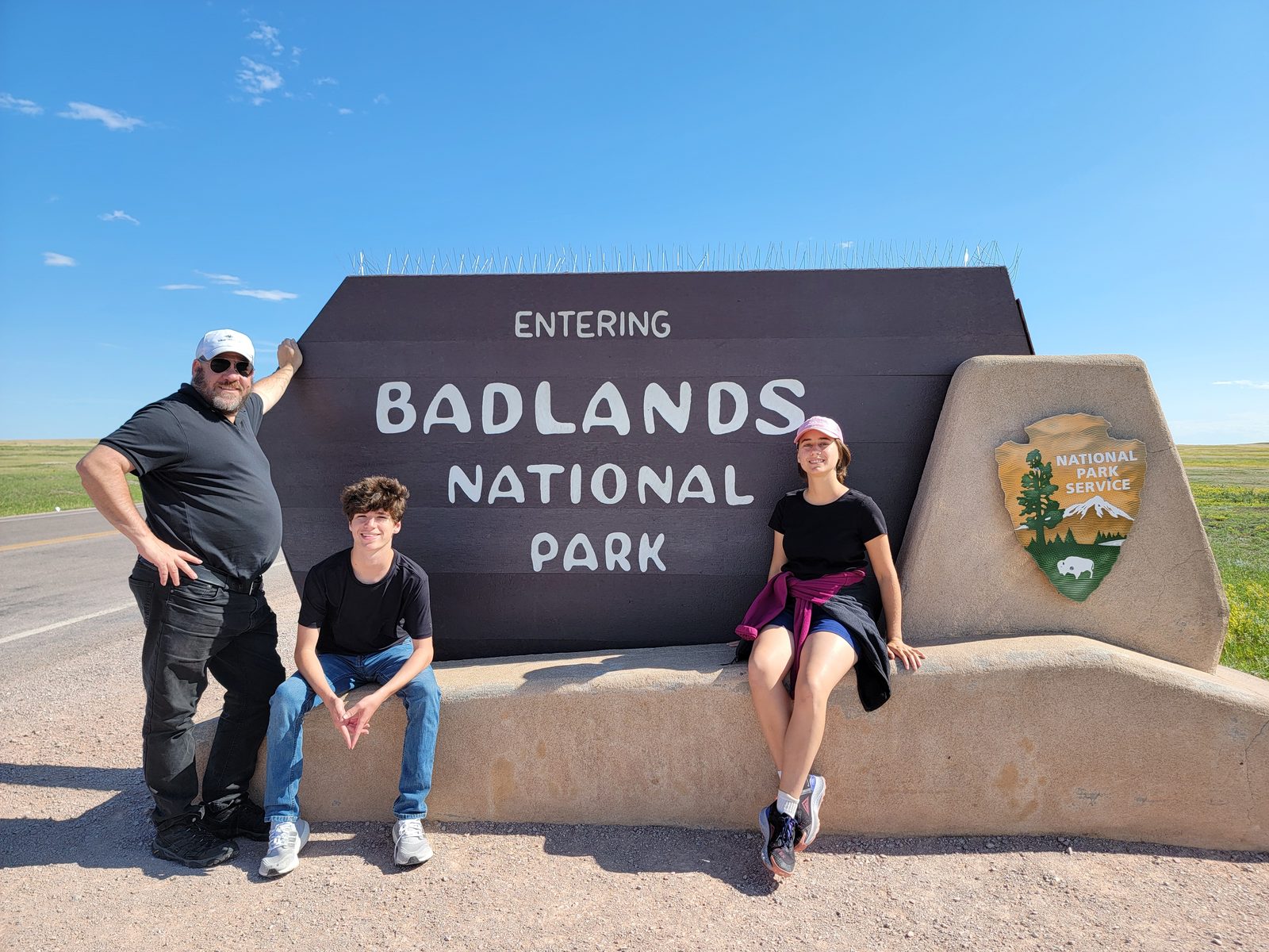 Michael, Thomas and Lisa at the Badlands entrance sign
