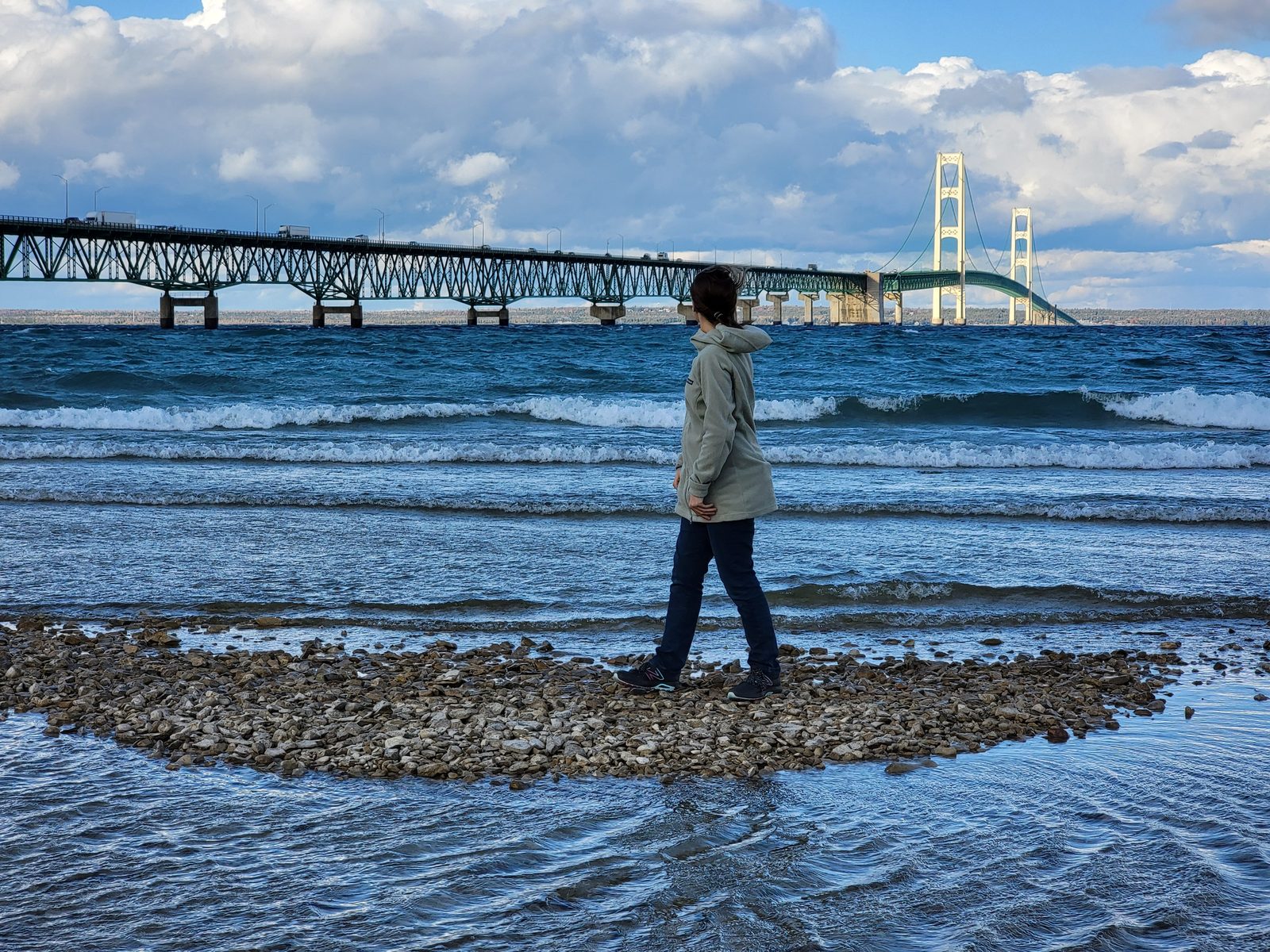 Walking the beach beneath the Mackinac Bridge