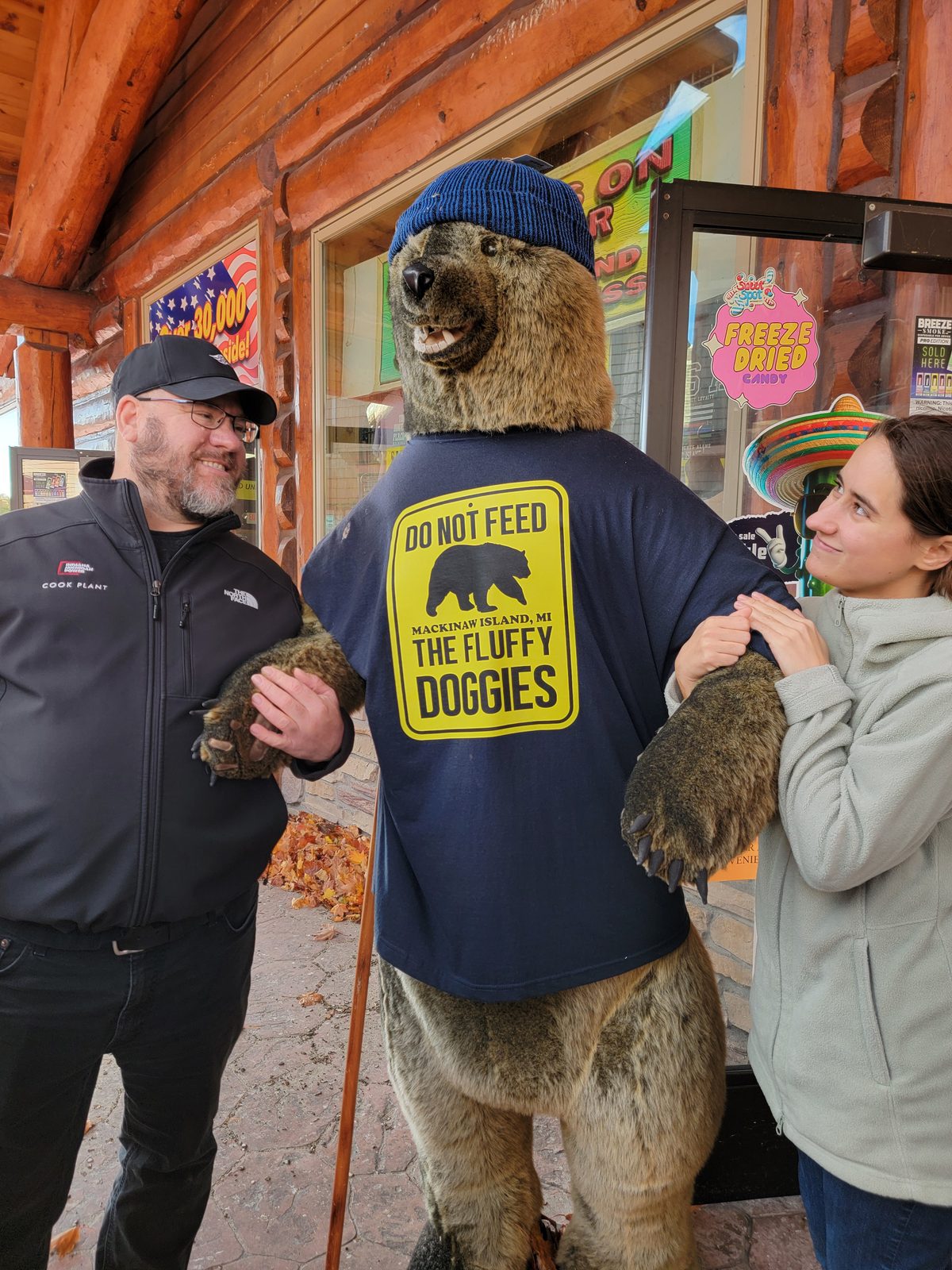 Lisa and Michael meeting the shop's bear mascot downtown