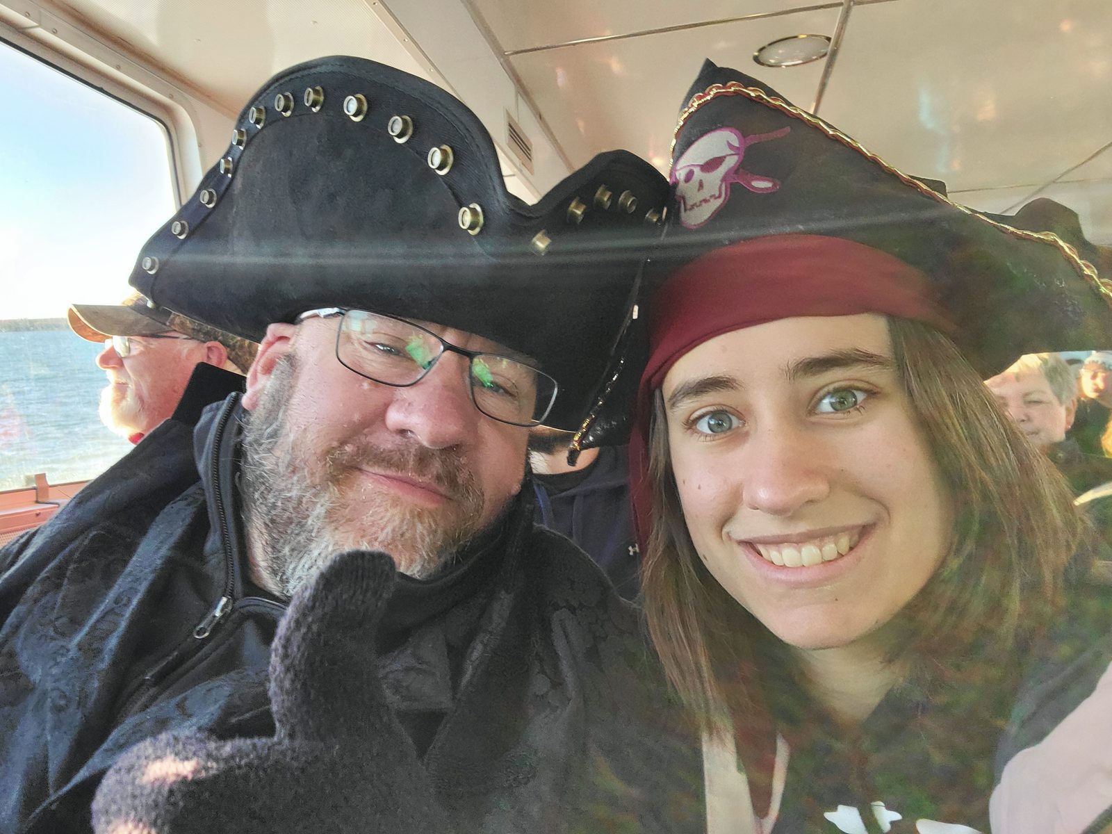 Lisa and me on the ferry, pirate hats on