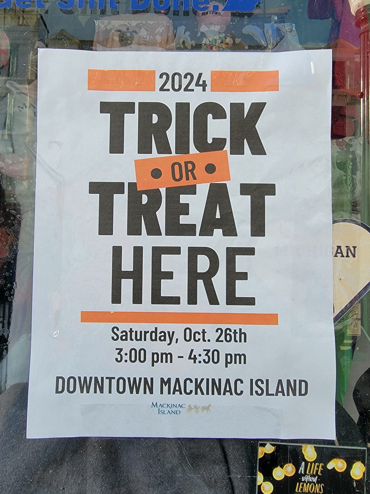 Trick or treat poster in a window on Mackinac Island