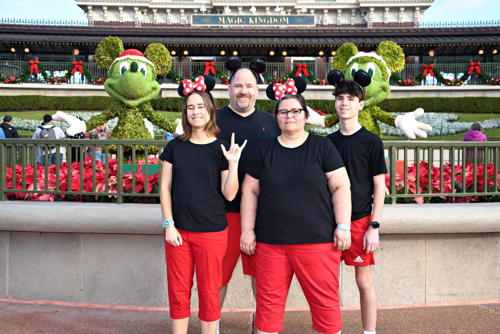 The four of us at rope drop in our Christmas Mickey ears
