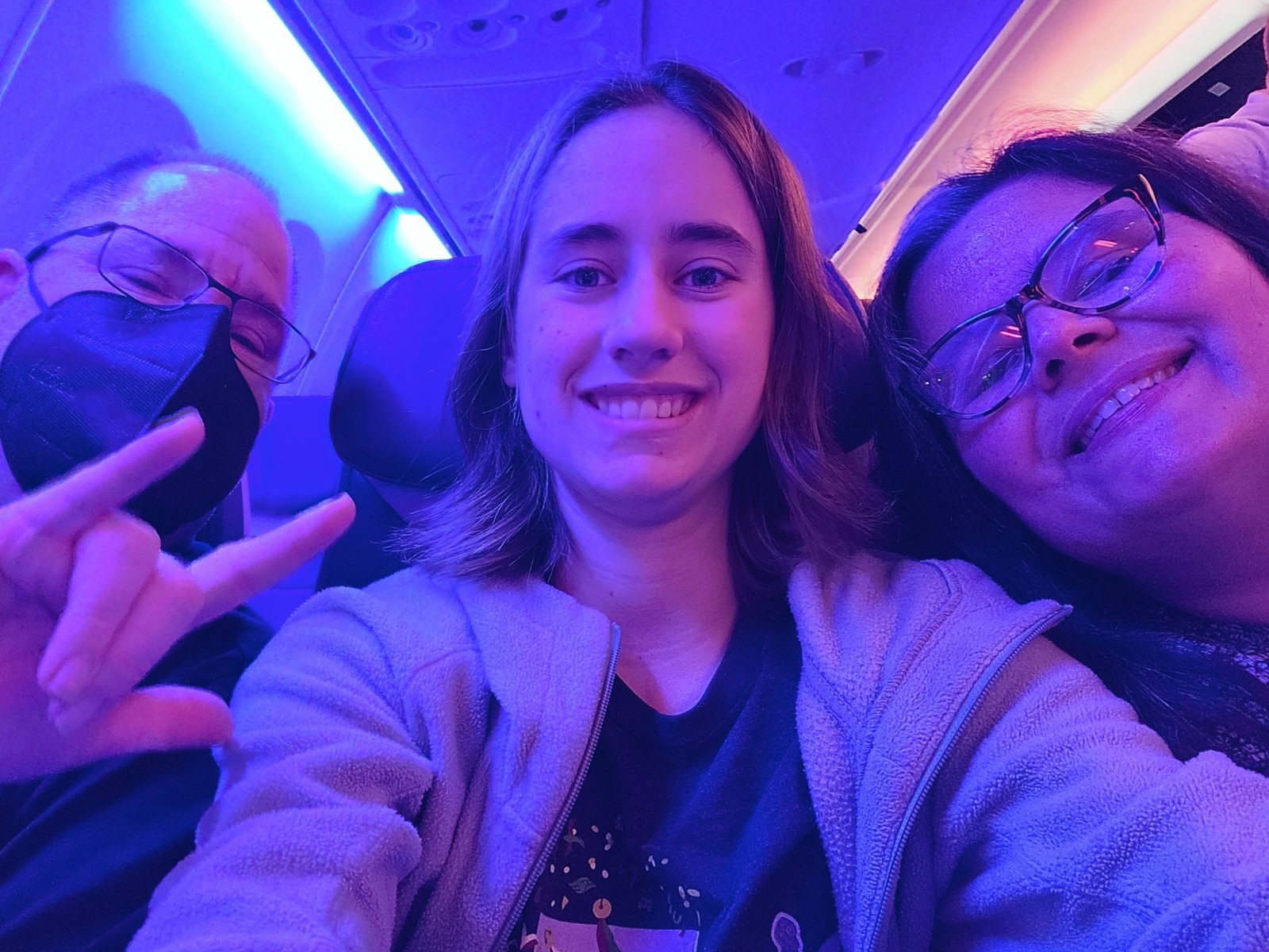 Lisa signs I love you next to us on the flight
