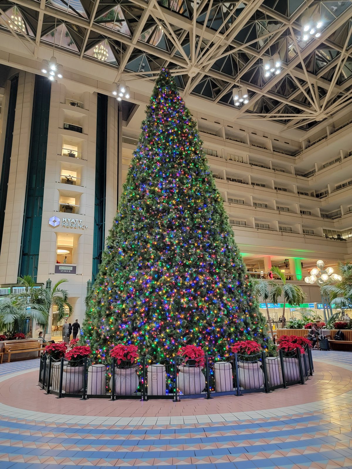 A huge Christmas tree in a multi-floor atrium