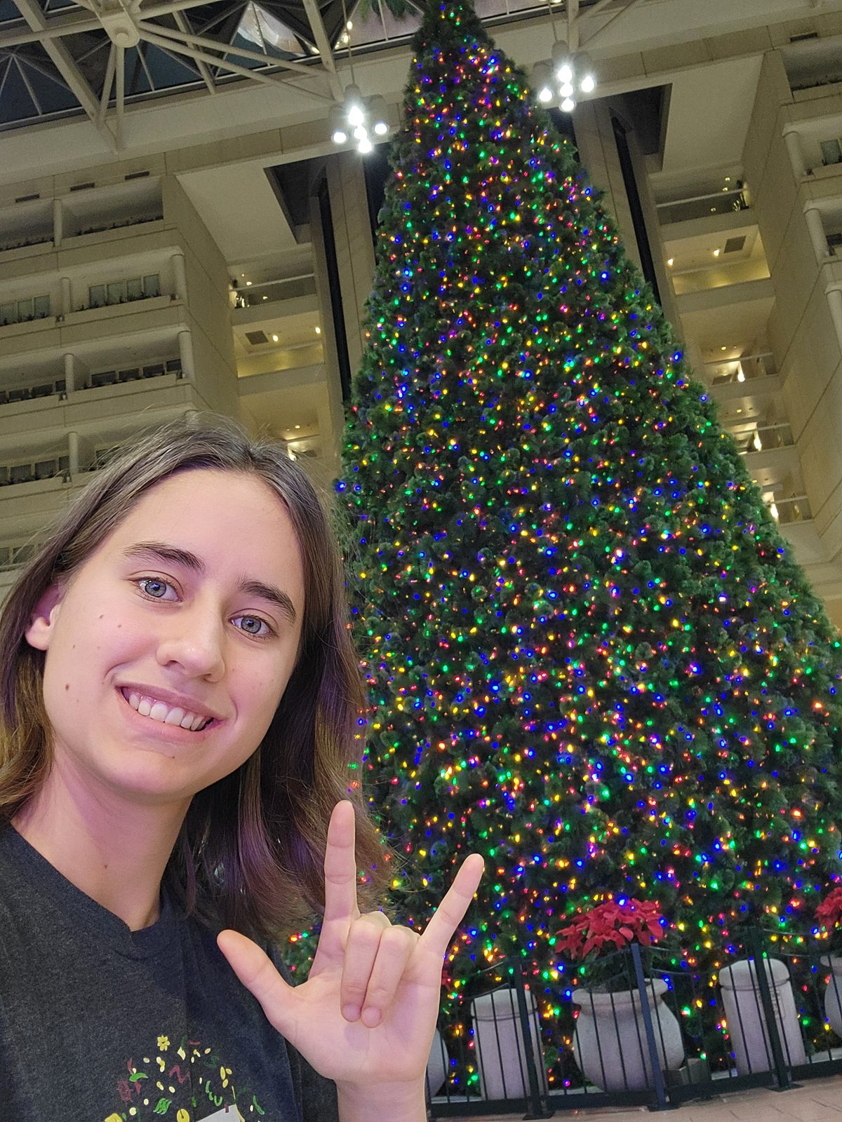 Lisa signing I love you at the lobby tree