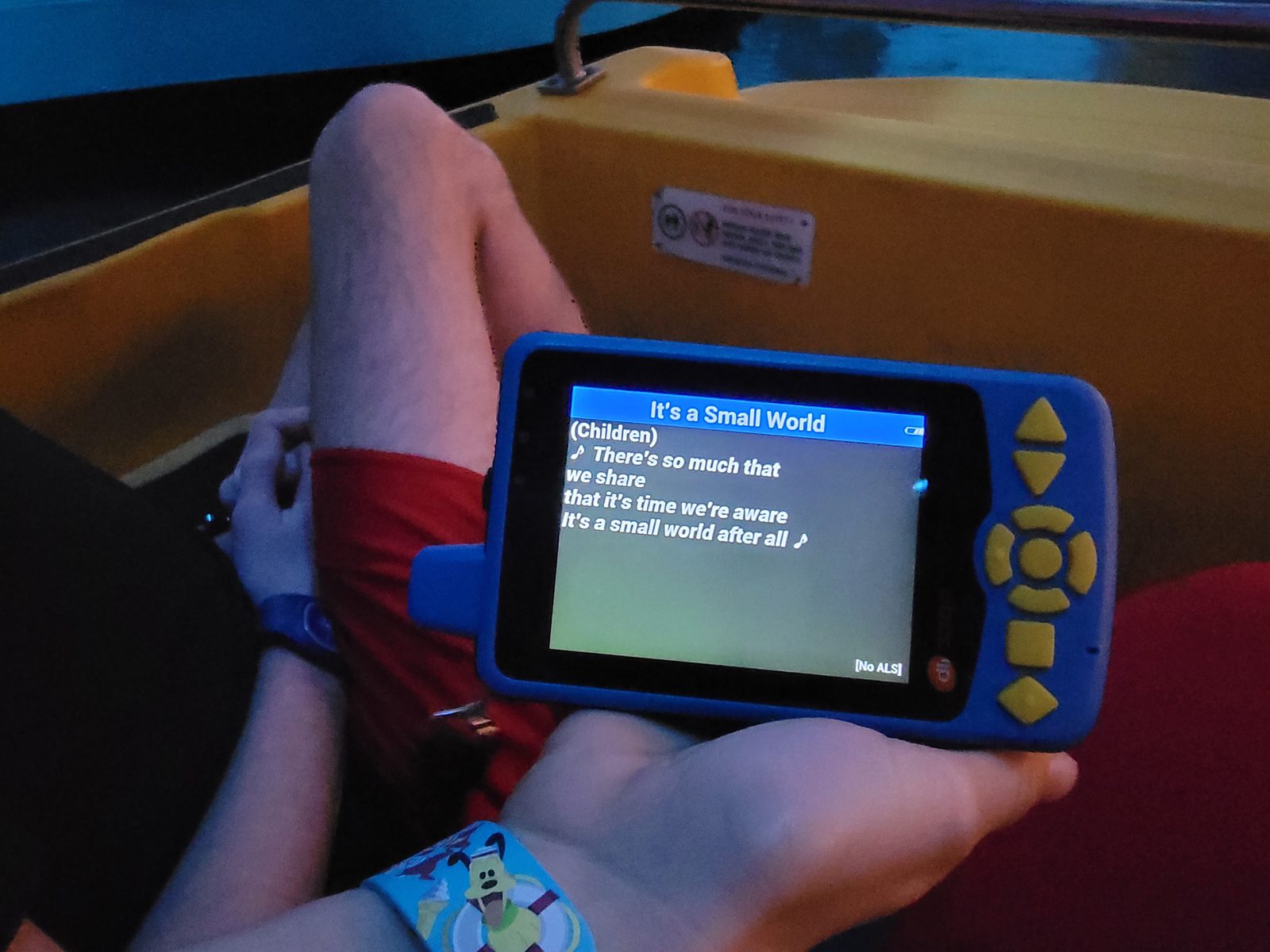 Lisa's captioning device following along on Small World