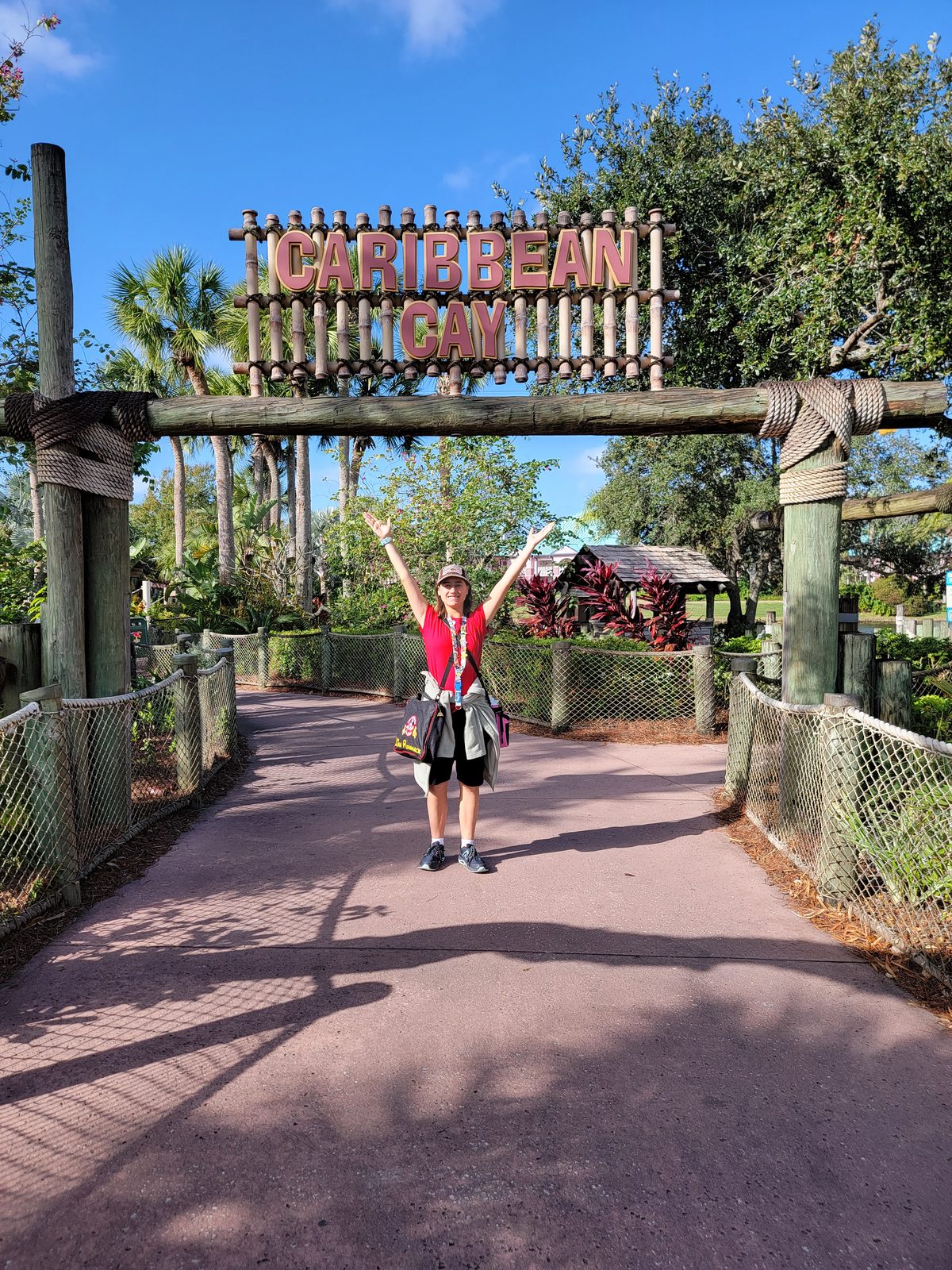 Lisa striking a pose under the Caribbean Beach sign