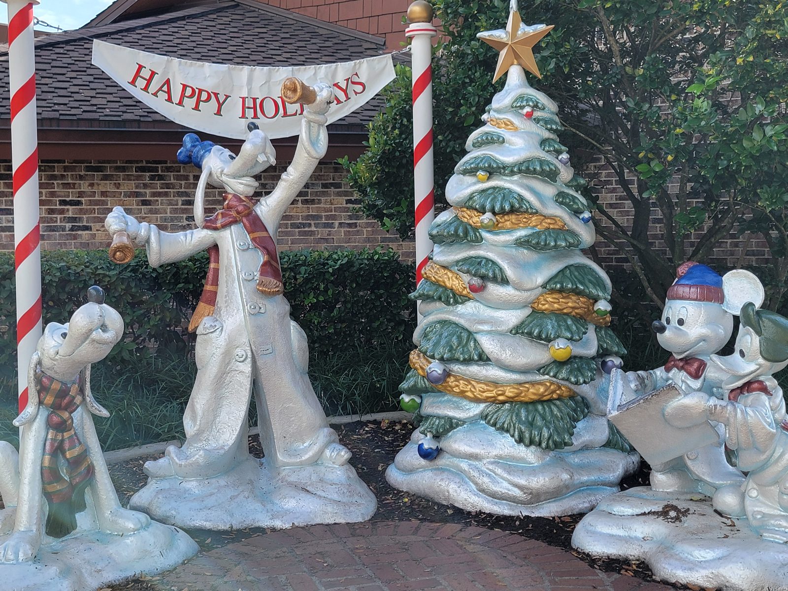 The Happy Holidays statues at Disney Springs