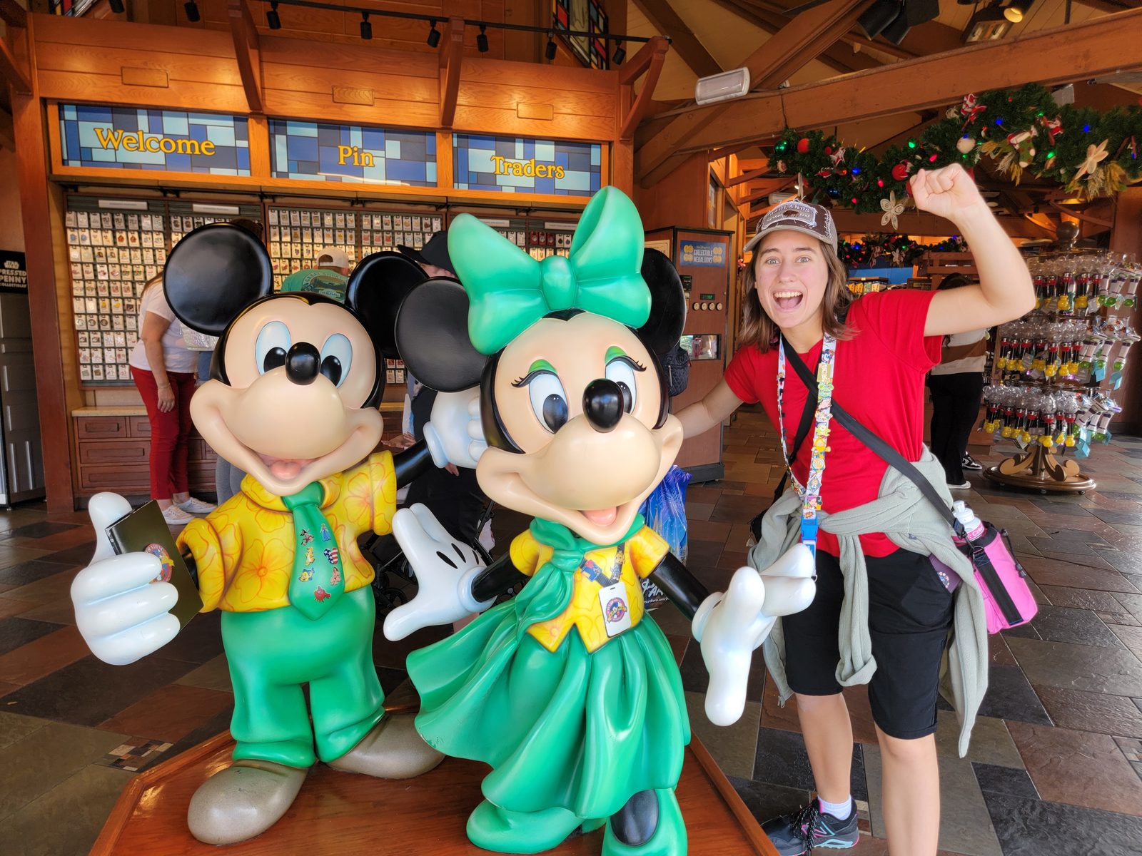 Lisa striking a pose with Mickey and Minnie