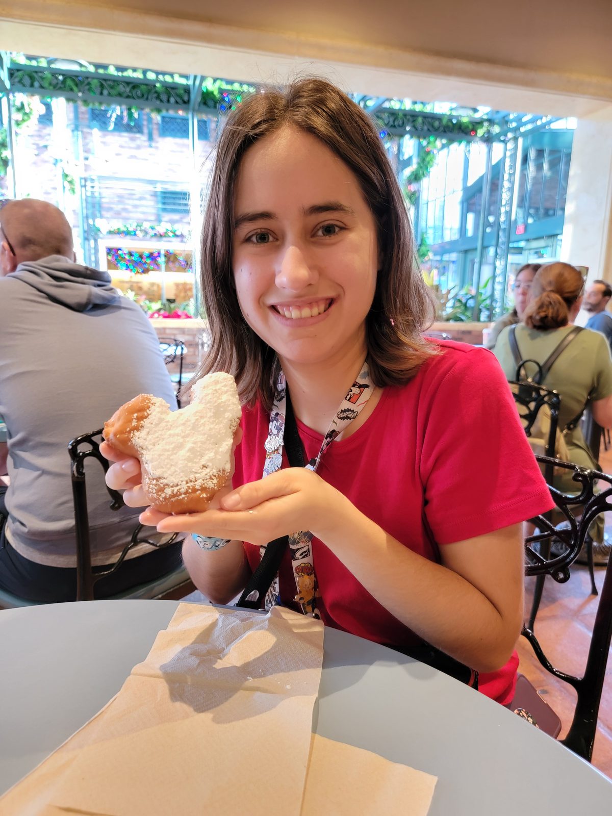 Lisa with her Mickey-shaped beignet
