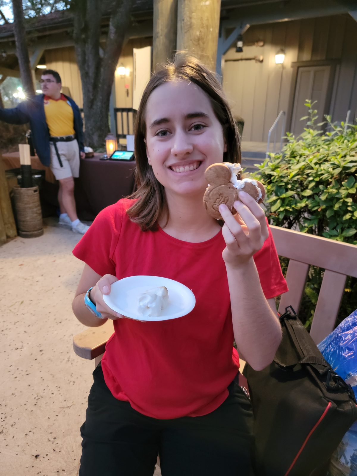 Lisa with a s'more at the campfire