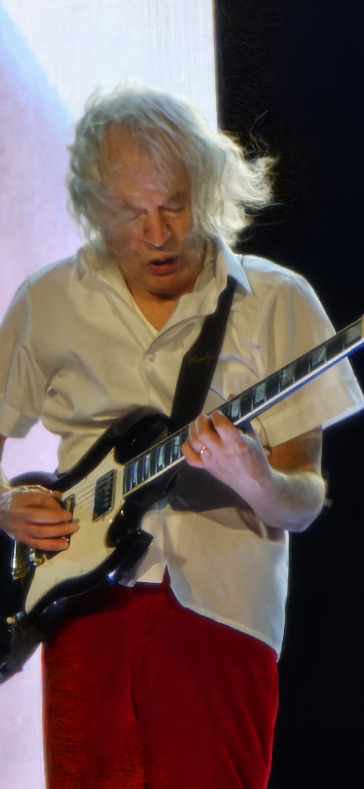 Angus Young on guitar
