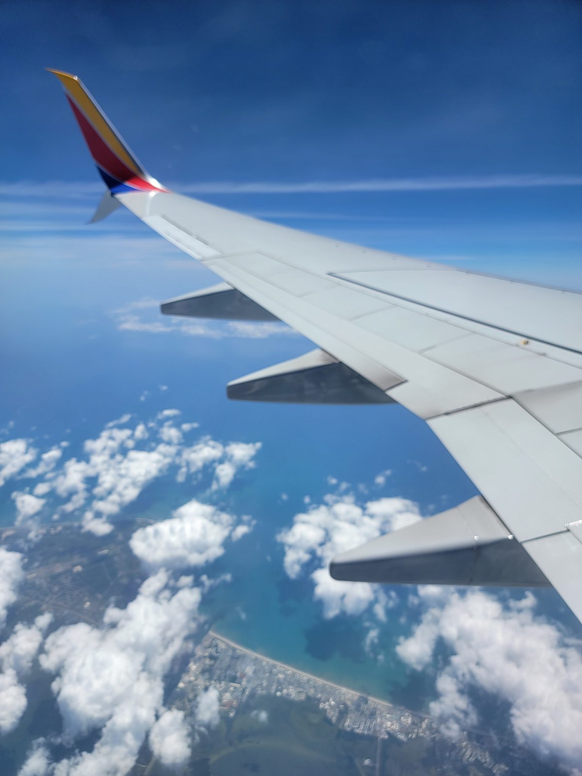 The wing view over turquoise Caribbean water