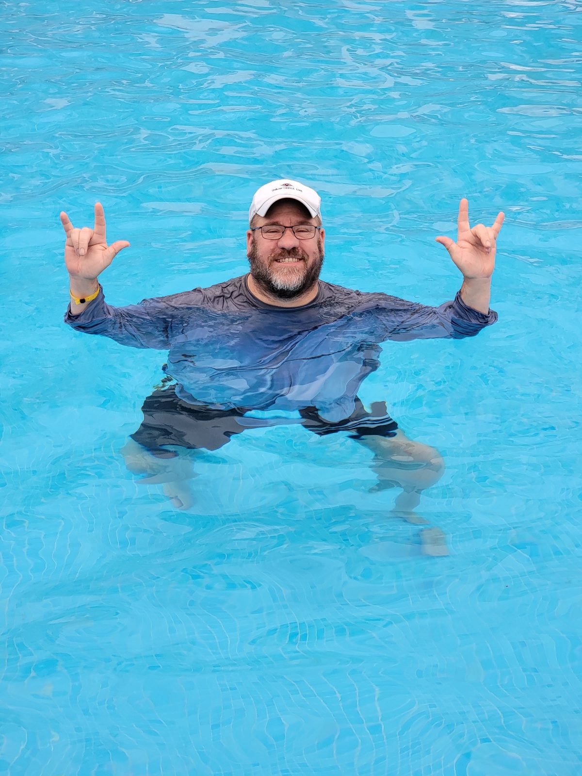 Michael in the pool at the Riu, signing I love you