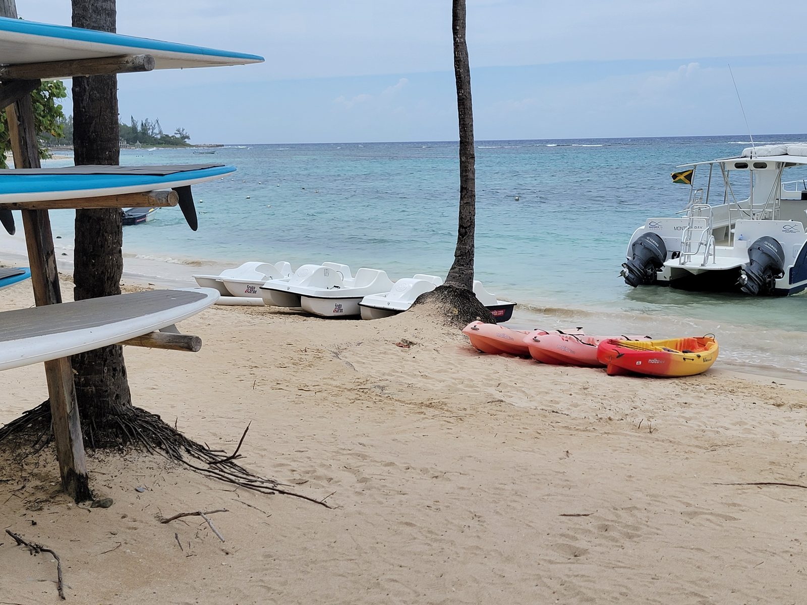 Paddleboards, kayaks and the snorkel boat waiting