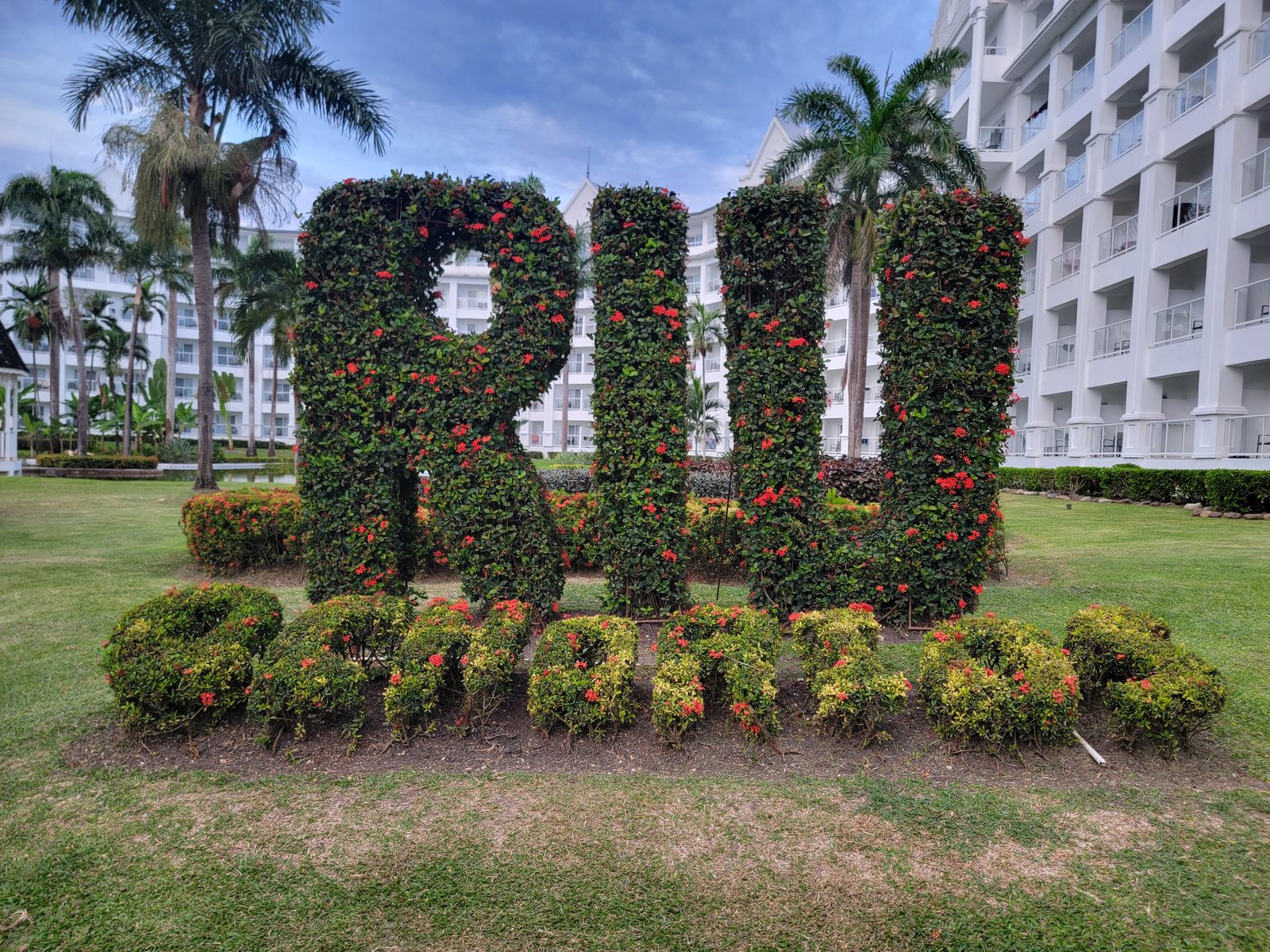 The RIU sign in the gardens at the Riu